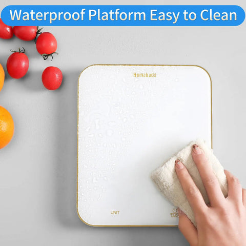 Digital Food Scale 33Lb Capacity With 1g Increments Ultra Precise Kitchen Scale For Cooking And Baking Grams And Ounces LED Display Battery Powered By 3 AAA White being cleaned with a cloth, showing waterproof feature.