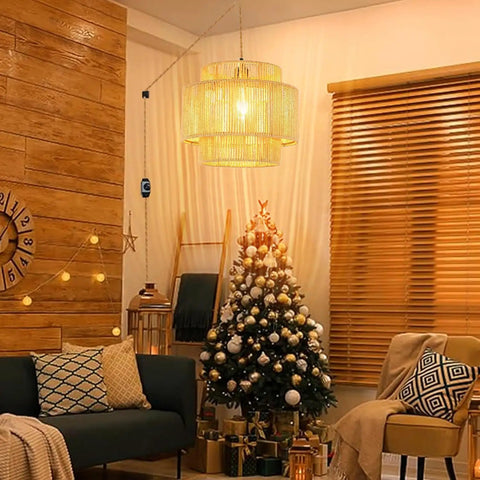 Handcrafted Rattan Plug In Pendant Light Featuring Smooth Dimmable Switch And Handwoven Wicker Bamboo Shade above a decorated Christmas tree in living room.
