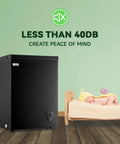 Compact Black Chest Freezer With 3.5 Cubic Feet Capacity, Space Saving Top Open Design, Hella Roomy Interior For Meat And Seafood Stashes, Plus Adjustable Thermostat To Keep Groceries Locked And Loaded Year Round next to a sleeping baby.