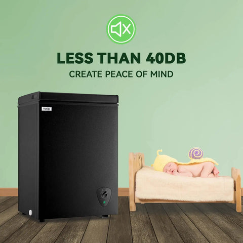 Compact Black Chest Freezer With 3.5 Cubic Feet Capacity, Space Saving Top Open Design, Hella Roomy Interior For Meat And Seafood Stashes, Plus Adjustable Thermostat To Keep Groceries Locked And Loaded Year Round next to a sleeping baby.