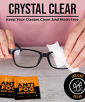 Front view: CareTouch Anti-Fog Lens Wipes; two orange packets beside black glasses being wiped with a white cloth