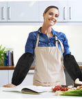 Heavy Duty Extended Arm Sleeve Covers For Men And Women, Dope Oil Resistant Protective Oversleeves In Matte Black worn while cooking.
