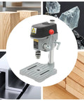 Sturdy Mini Bench Drill Press For Woodworking And Metal Crafting with precision chuck, shown alongside wood and metal samples.