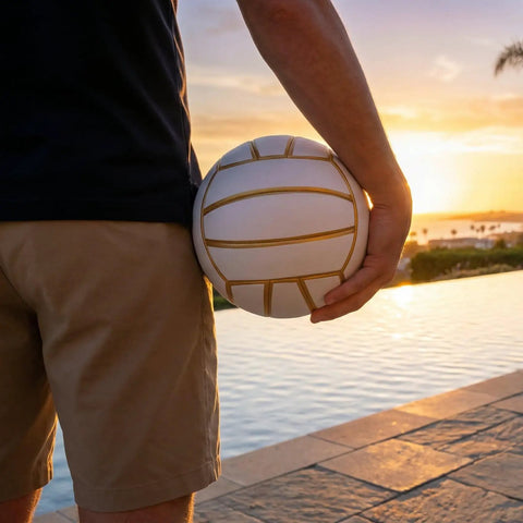Golden White Volleyball Official Size 5 With Minimalist Design And Vibrant Colors For Street, Beach And Indoor Play held by person