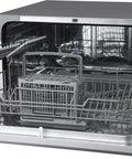 Interior view of Compact Countertop Dishwasher Featuring Stainless Tub And Seven Quick Wash Options Handles Six Place Settings No Stress In Tight Spaces Energy Star Certified Silver Machine.