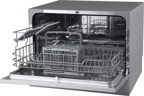 Interior view of Compact Countertop Dishwasher Featuring Stainless Tub And Seven Quick Wash Options Handles Six Place Settings No Stress In Tight Spaces Energy Star Certified Silver Machine.