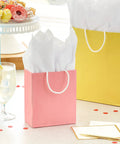 Pastel Color Recyclable Gift Bag Set With Eight Assorted Sizes For All Occasions, pink gift bag with white tissue paper on table