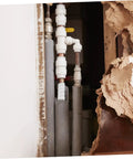 Two-Pack Flexible Seal Tape For Plumbing Repairs on exposed pipes, showing self-adhesive rubberized silicone sealant in use.