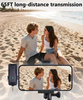 Couple on beach using 4 in 1 Wireless Lavalier Microphone With Universal Receiver For iPhone Android Cameras