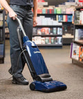 Professional Bagged Upright Vacuum Kicks Serious Dust With Smooth Glide Action Commercial rated design used in a bookstore.