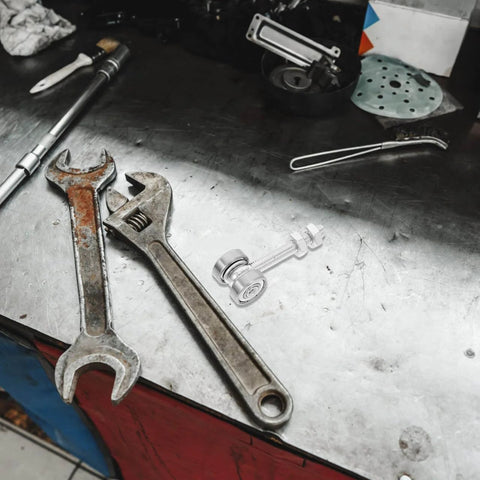 Detachable Double Bearing Groove Sliding Door Pulley 2.79 Inch Stainless Steel Track Roller on workshop table with tools