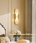 Natural Spanish Alabaster Wall Sconce, 19.7" High Marble Wall Sconces, G9 mounted beside a bed in a cozy interior.