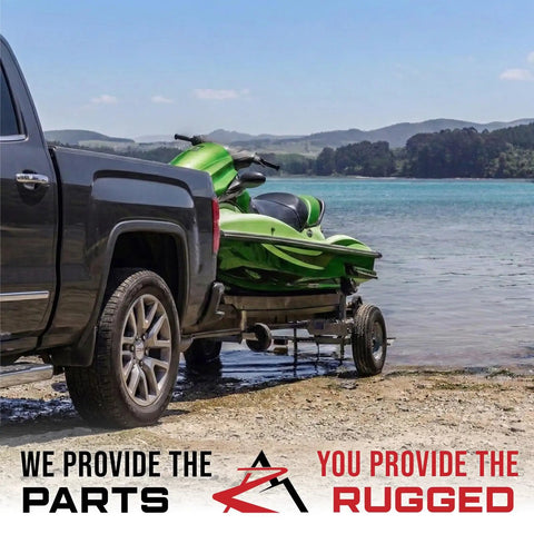 Pack Of Two Rugged Trailer Axle Kits With Four On Four Bolt Pattern Idler Hub And One And One Quarter Inch Round BT8 Spindle on a trailer with a green jet ski.