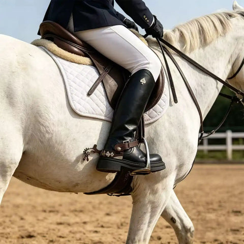 Old School Western Cowboy Spurs With German Silver Hand Engraved Trims Jingle Bobs Rowel on rider's boot on white horse
