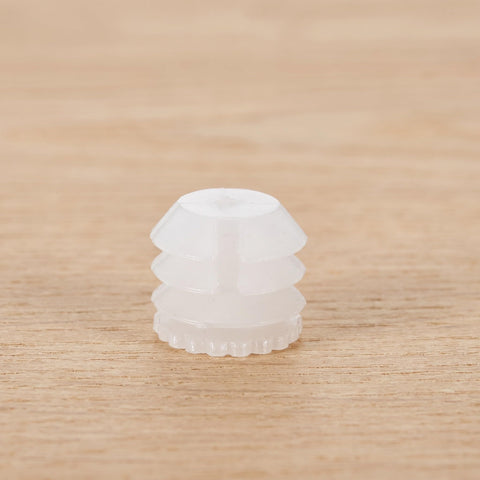 White dowel from Heavy Duty Hinge Dowel Inserts Kit With M4x8mm Expansion Nuts And Self Tapping Screws, close-up on wooden surface