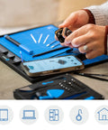 Hands using Magnetic FixMat Electronics Repair Mat With Dry Erase Grid And Sorting Bins Portable Screw And Part Organizer
