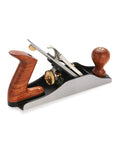 Pro Grade Number Four Bench Plane Built Like A Tank For Intense Shop Sessions Smooths Rough Boards Effortlessly with a wooden handle.