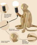 Resin Sitting Monkey Table Lamp With LED Light, Cute Animal Desk Lamp For Living Room, Bedroom, Home Office And Kids Room, Stylish Gold Finish, Handcrafted Decor Accent, showcasing details of lamp holder, wire, and monkey design.