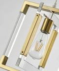 Close-up of Gold Pendant Light Chandelier With Brushed Brass Finish highlighting acrylic and metal frame, showing bulb.