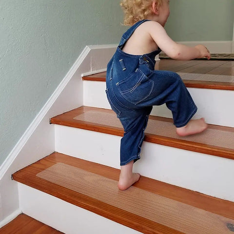 Child safely climbing stairs on Non Slip Stair Treads 4x24 Inches, 15 Pack Transparent Anti Slip Strips, PEVA, home safety upgrade