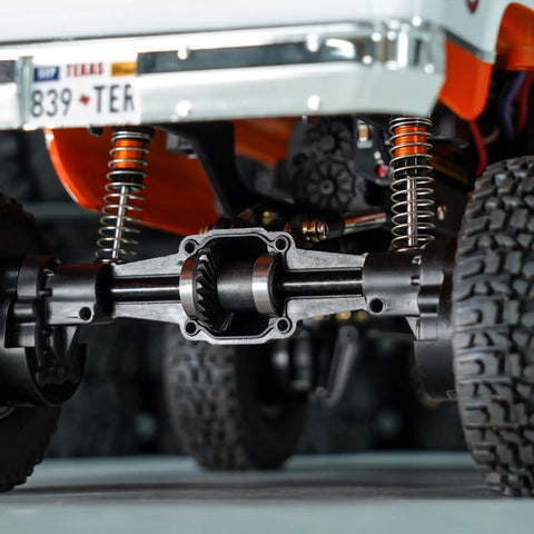 Beefed Up 12/24T Steel Alloy Axle Gear Set For 1/24 RC Crawler Upgrade installed on rear axle, showing helical gear details