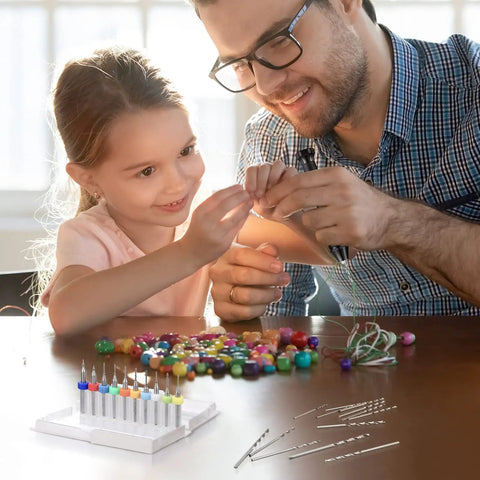Parent and child using Pro Grade 59 Piece Hand Drill Bits Set With Pin Vise And Micro Twist Bits Plus 10 Tungsten Carbide PCB Rotary Bits for crafting.