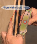 Installing sliding patio door rollers replacement hardware on a wood frame, aligning with screw holes for secure attachment.
