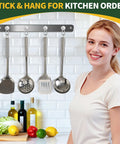 Built Tough 12 Pack Heavy Duty Magnetic Hooks With Swivel Carabiner 70 Pound Nailed Grip 360 Degree Rotating Magnet Clamps For Garage Shelves And Gear Easy Peasy Organization hanging kitchen utensils on a metal wall rack.