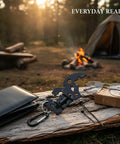 Slim Metal Multitool Card With Screwdriver And Bottle Opener Credit Card Size for Wallet on wood near campfire