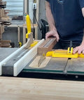SavR Push Block For Table Saw And Router Table, With Magnetic Fence Mount in use, guiding wood past saw blade with safe grip.