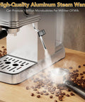 No Fuss Barista Style Shots At Home With This Compact Stainless Steel Espresso Maker Featuring 20 Bar Pressure Integrated Steam Frother And Roomy 45 Oz Water Tank For Silky Lattes steam wand close-up producing froth over coffee beans.