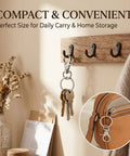 Heavy Duty Metal Swivel Snap Hooks Twelve Pack Slick 360 Spin Trigger Clips For Purses And Keychains hanging on a wall hook with keys.