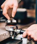 Barista using 53mm Espresso Tamper With Walnut Handle, Weighted Coffee Tamper for Barista-Grade Espresso, Fits 53mm and 54mm Portafilters