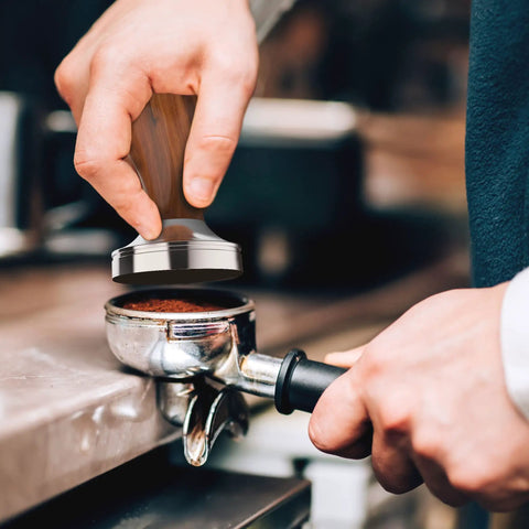 Barista using 53mm Espresso Tamper With Walnut Handle, Weighted Coffee Tamper for Barista-Grade Espresso, Fits 53mm and 54mm Portafilters