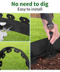 Close-up of No Dig Garden Edging Border Kit 33 ft with spiral spikes being cut and installed into the ground, black plastic
