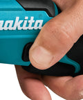 Detail of hand gripping the lock trigger on the Badass Compact 12V Max Lithium Ion Cordless Multi Cutter with blue finish.