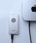 USB4 NVMe Enclosure With Active Cooling Fan And Solid Aluminum M.2 SSD Case For Mac iPad Pro connected to a workstation.