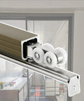 Heavy Duty Sliding Barn Door Hardware Track System With Silent Steel And Nylon Roller Wheels, aluminum track with rollers close-up.