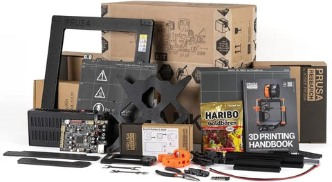 MK4S 3D Printer Kit with Automatic Calibration and Removable Sheets components, including parts and printed handbook, for DIY setup.