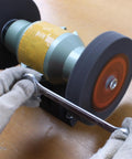 Premium Nylon Deburring Wheels 6 Inch, 180 Grit Silicon Carbide Buffing Pads 5 Pack in use on a bench grinder.