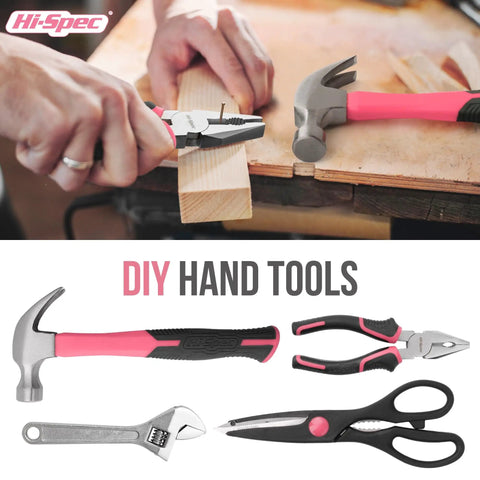 Pink 54 Piece Home DIY Tool Kit Set For Women Beginner Friendly Hand Tools including hammer, pliers, scissors on a wooden surface