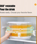 Five Point Five Liter Rotating Beverage Dispenser With Four Separate Compartments And Dripless Spigot, shown rotating in fridge, with orange juice.