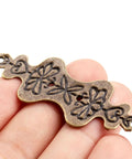 Close-up of Antique Bronze Corner Bracket from 150 Pcs Set for Wood Boxes Cabinets with Retro Vibe Vintage Style