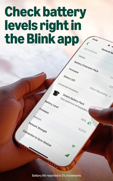 Hand holding smartphone displaying battery level and settings for Ditch The Cords Hassle Free Solar Smart Security Camera With True 2K Video Feed.