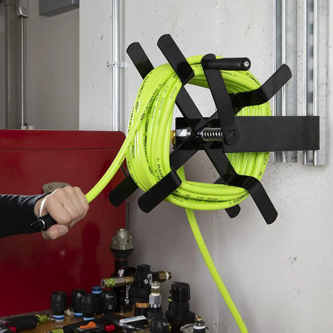 Open Face Air Hose Reel Three Eighth Inch By 50 Foot Heavy Duty Lightweight Hybrid ZillaGreen with swivel handle in use.