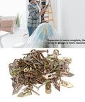 Close-up of 40 Pack Heavy Duty Drywall Anchors With Screws Kit Self Drilling Knock Type scattered on a surface.