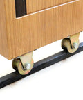 Straight Up Heavy Duty Galvanized Steel Track Wheel Featuring Rock Solid Double Bearings For Slick Sliding Gate Roller And No Junk Barn Door Caster On 50 Millimeter Wire Rope Rails attached to wooden panel on black track.