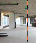 Telescoping Laser Level Pole With Tripod, 12 Ft / 3.7 M Reach, Adjustable 1/4-20 Mount in a construction layout site