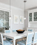 MKonpeny Modern Crystal Moon Pendant Light, 3000K 7W Led Pendant Light Kitchen Island, Brush Nickel Pendant Light over a dining table.