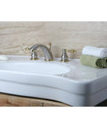 Victorian Style Widespread Bathroom Faucet In Brushed Nickel And Polished Brass Finish on a white sink, deck mount.